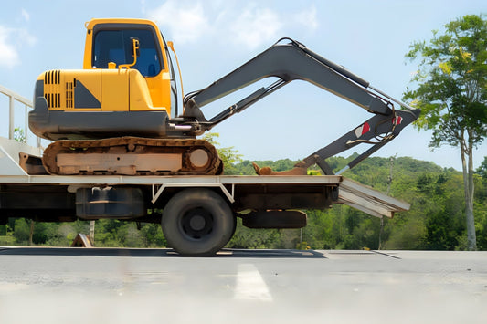 a mini excavator being transported in a properly sized trailer