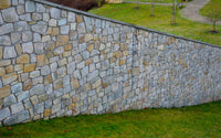 How to Build a Retaining Wall on a Slope: Complete Guide (2025)